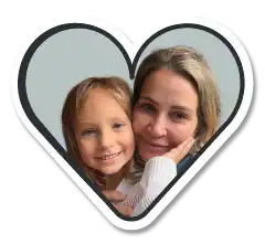 A heart-shaped sticker featuring a photo of a woman and a young girl.