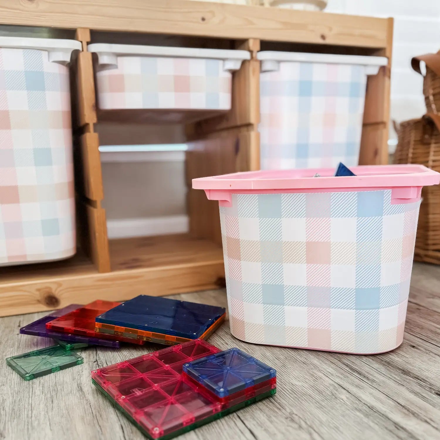 Stylish patterned storage containers with colorful toys and wooden shelving