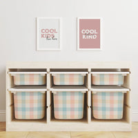 Wooden storage unit with pastel plaid bins.